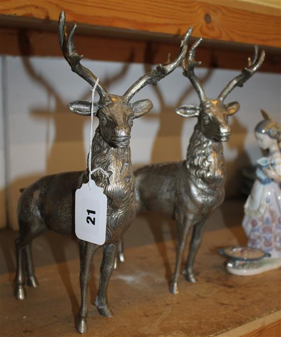 2 metal figures of deer